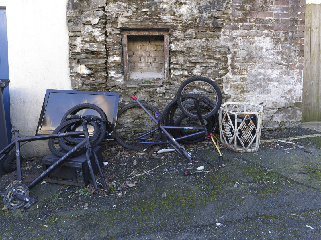 "Rubbish left out the back of a house" stock image