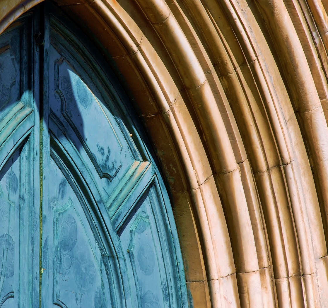 "Football (soccer) ball impressions on a church door, obviously being used as practice target or goal. Rome, Italy." stock image