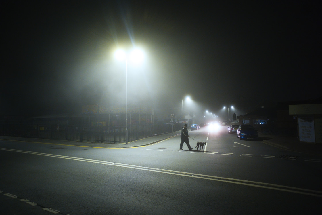 "Atmospheric grainy shot of street at night" stock image