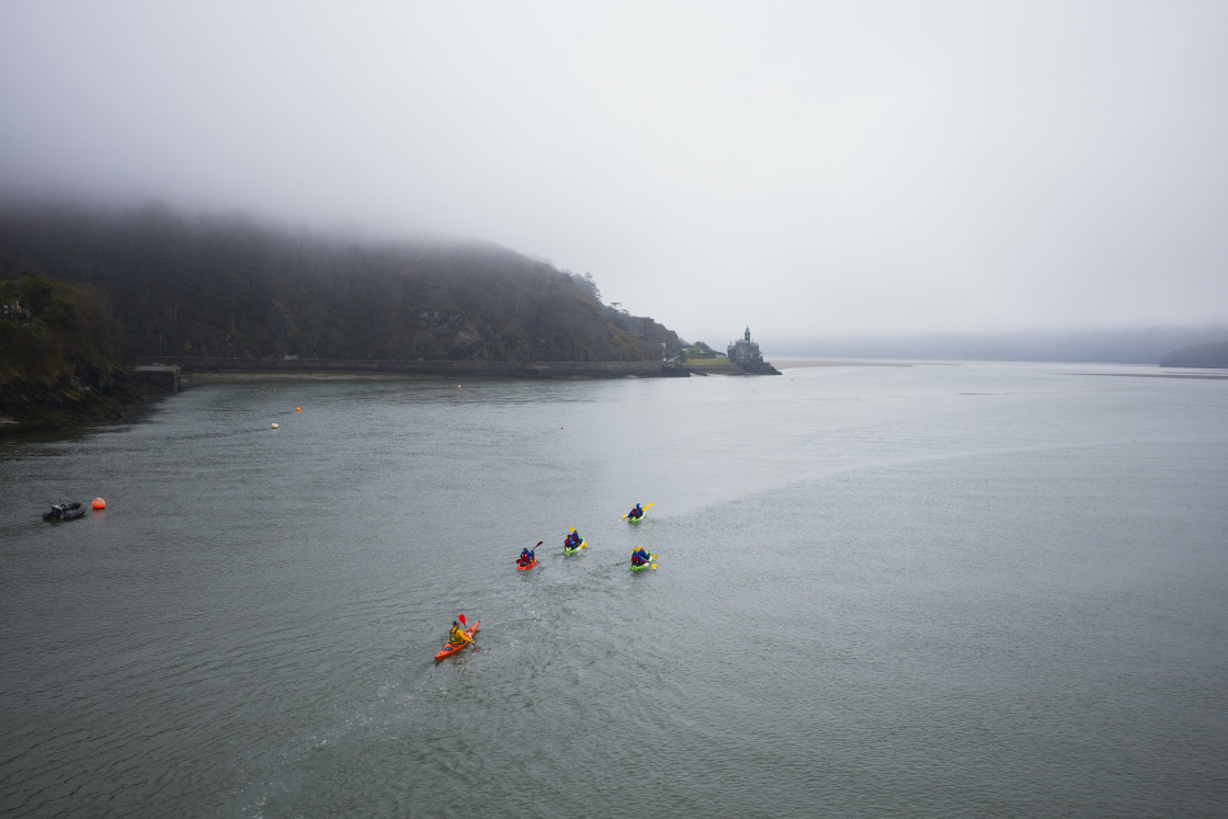 "A party of kayakers paddling" stock image