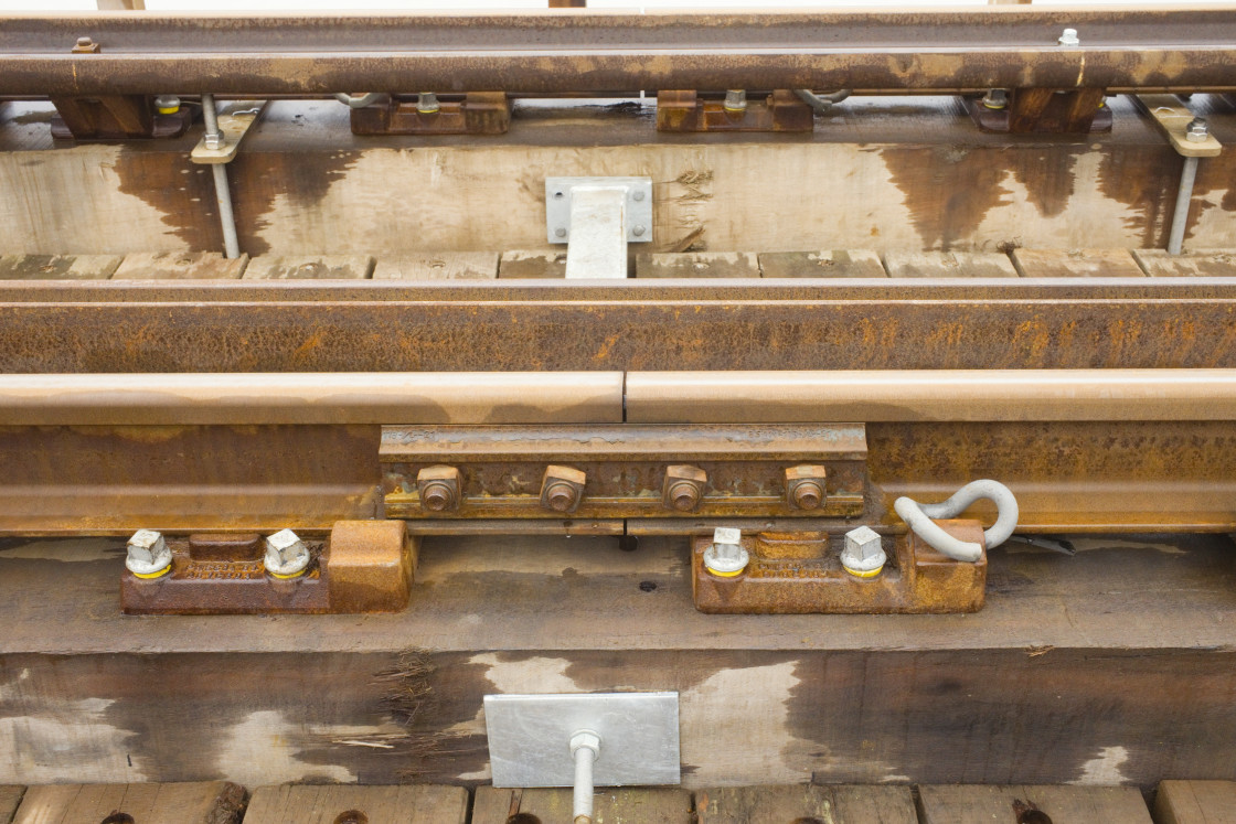 "Close up view of a steel railway track join" stock image