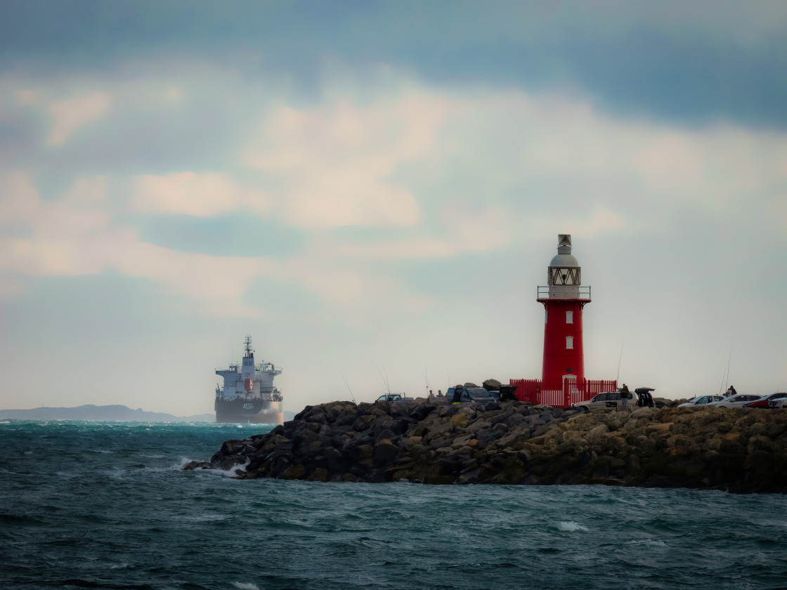 "North Mole Lighthouse with Ship" stock image