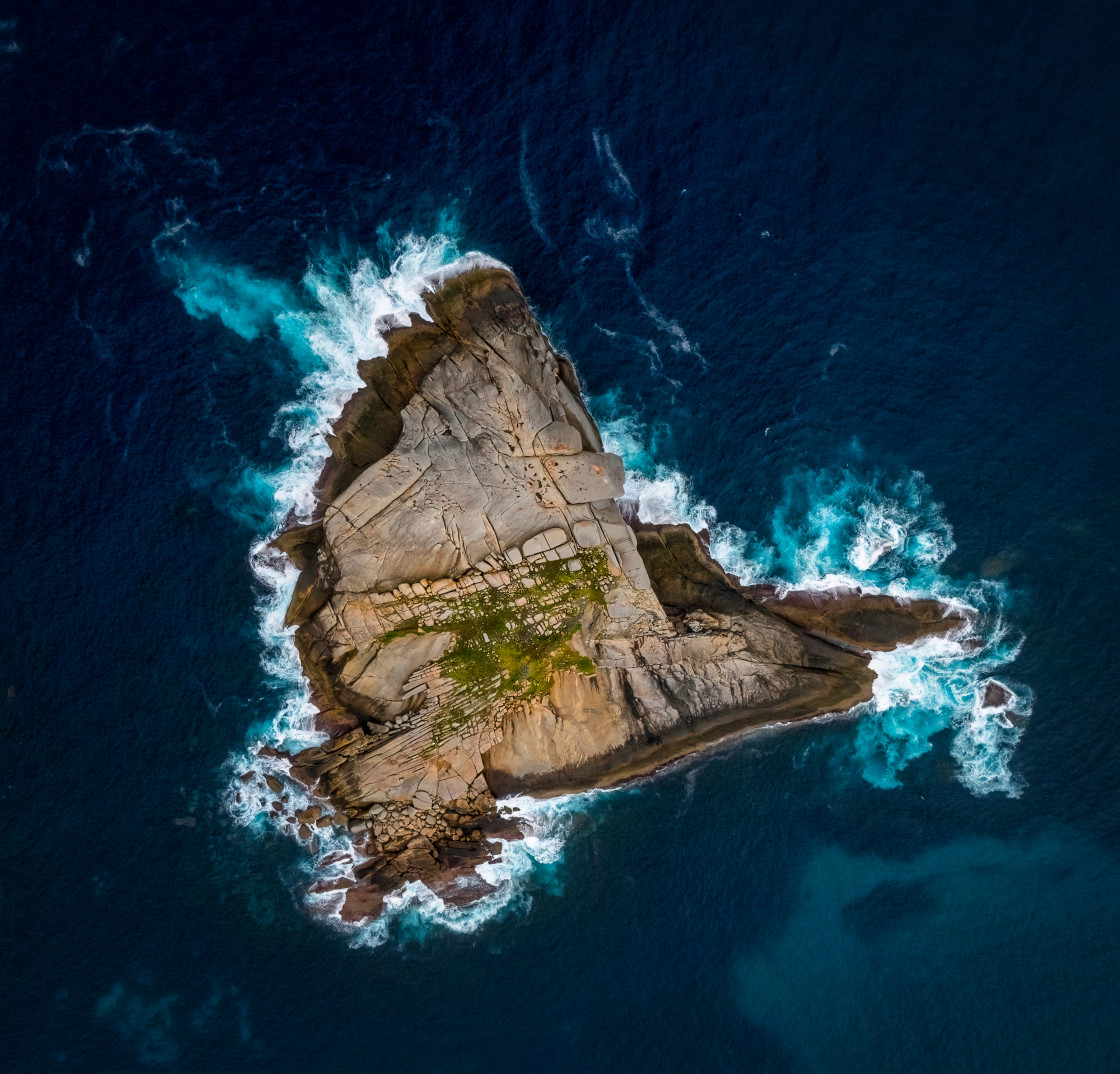 "Rocky Island with Breaking Surf" stock image