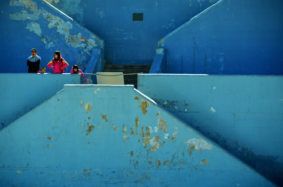 "Tourist family, standing on the seawall steps, looking out over the Pacific Ocean, La Jolla, CA." stock image