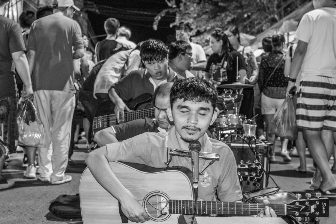 "A street musician band made up of blind members in the night market area of Chiang Mai Thailand" stock image