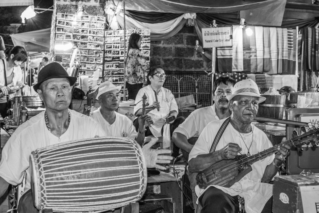 "A street musician band composed of senior members in the night market area of Chiang Mai Thailand" stock image