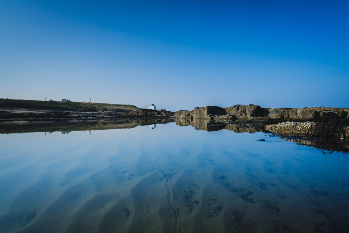 "Bamburgh Lighthouse on a Bright Spring Day" stock image