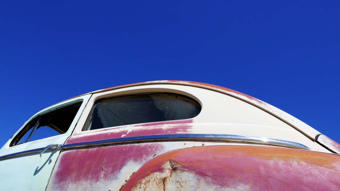 "Paint-less VW bug at a scrap yard." stock image