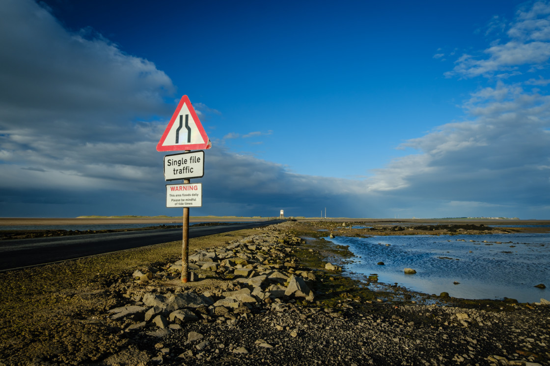 "Tidal causway at Holy Island, Northumberland, England" stock image