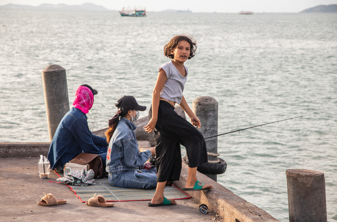 "A Thai family fishing at a pier in Naklua Thailand Southeast Asia" stock image