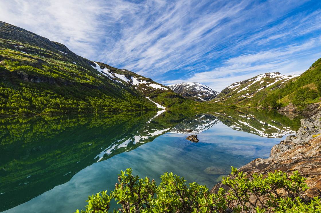 "Mountains reflects in still lake" stock image