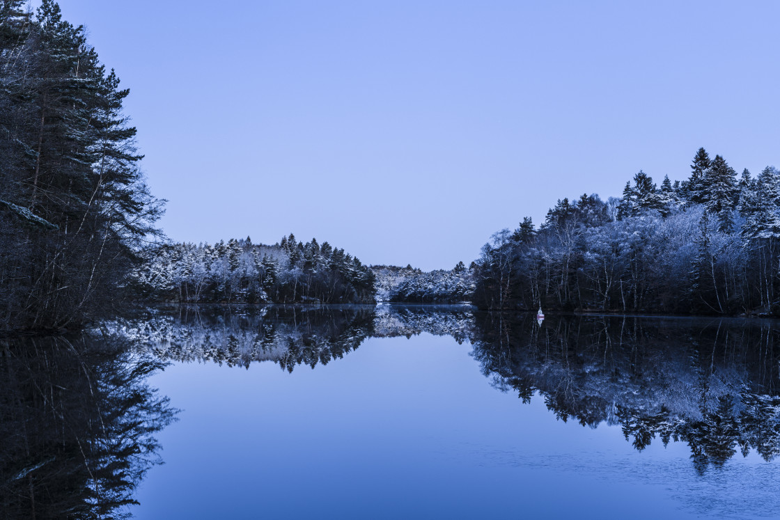 "Blue hour at frosty and calm lake" stock image