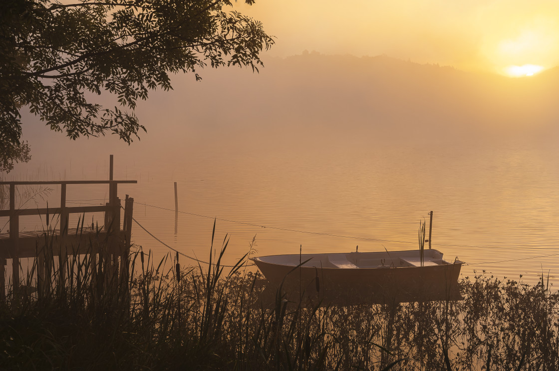 "Wooden boat by pier near lake" stock image