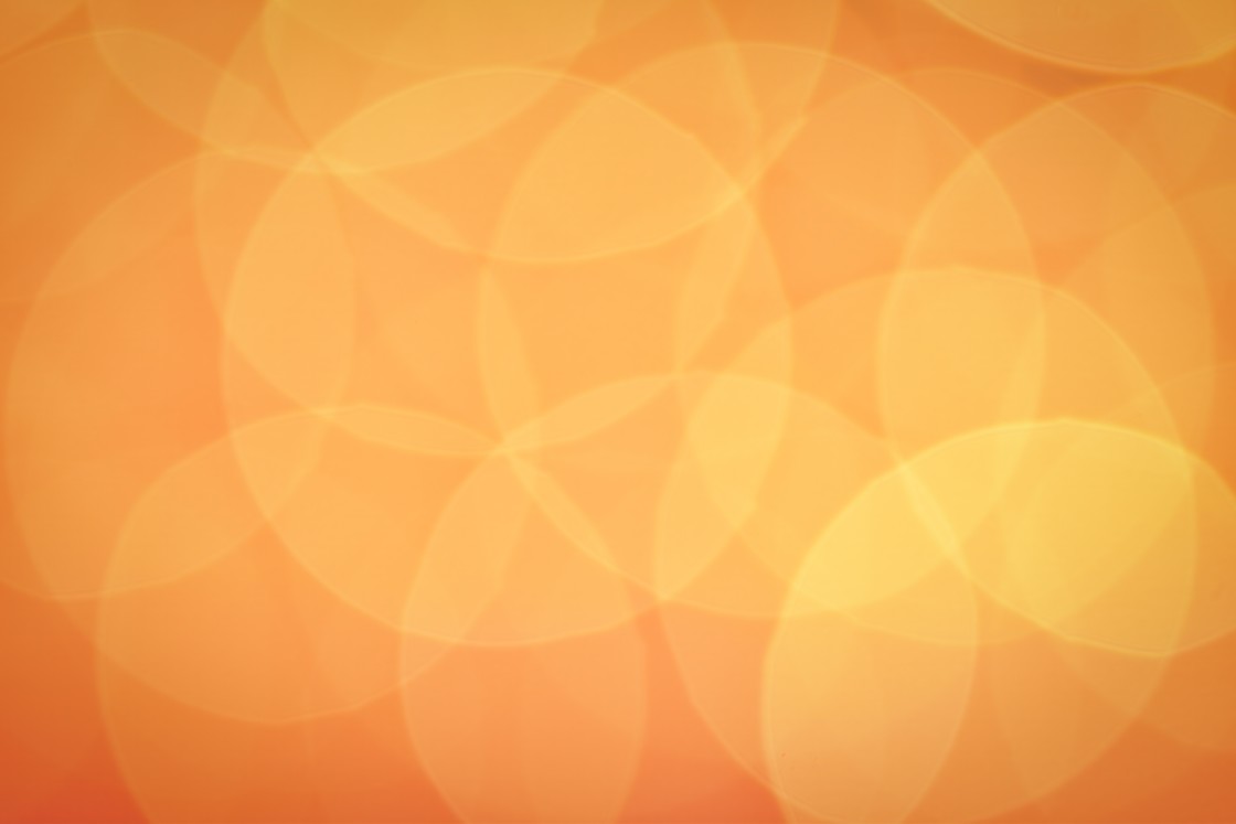 "Orange bokeh background, light creating floral pattern" stock image