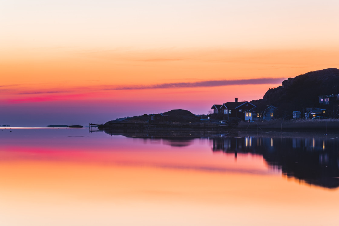 "Buildings at sea during beautiful sunset" stock image