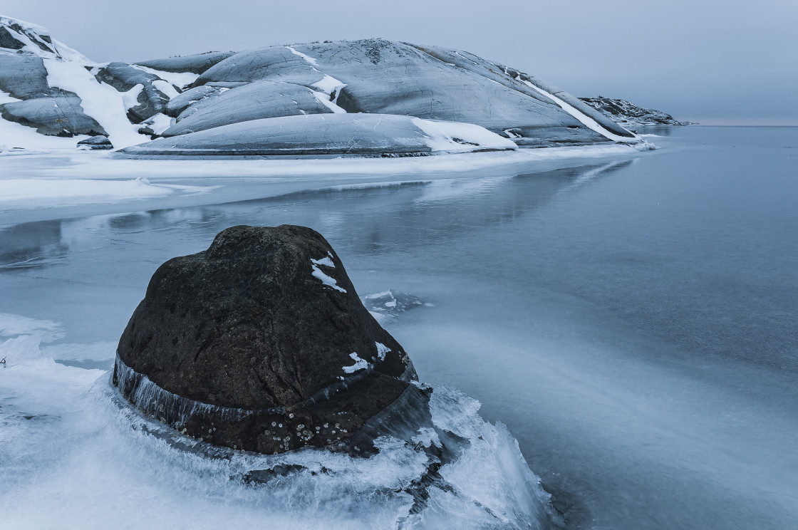 "Stone at frozen coastline, Sweden" stock image