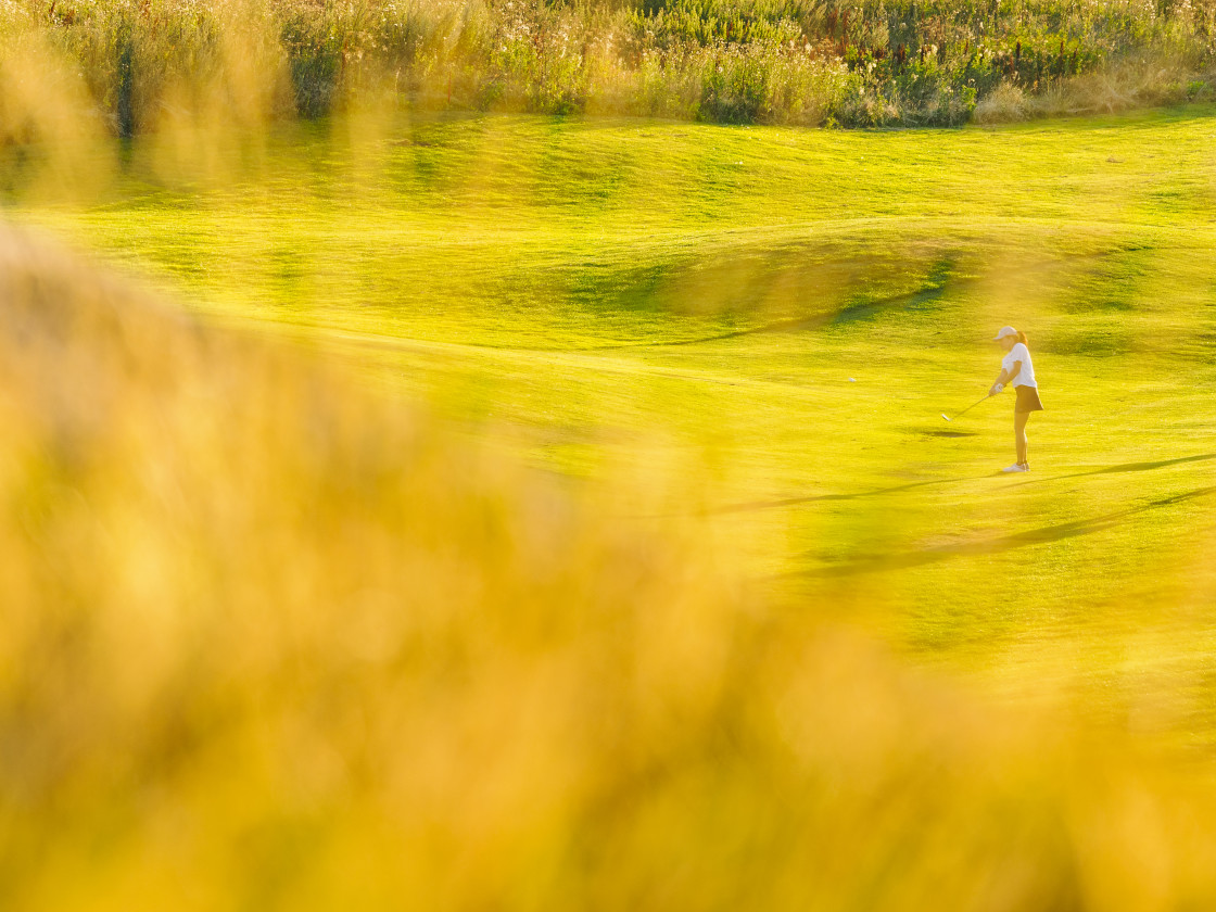 "Grass in front of woman playing golf" stock image