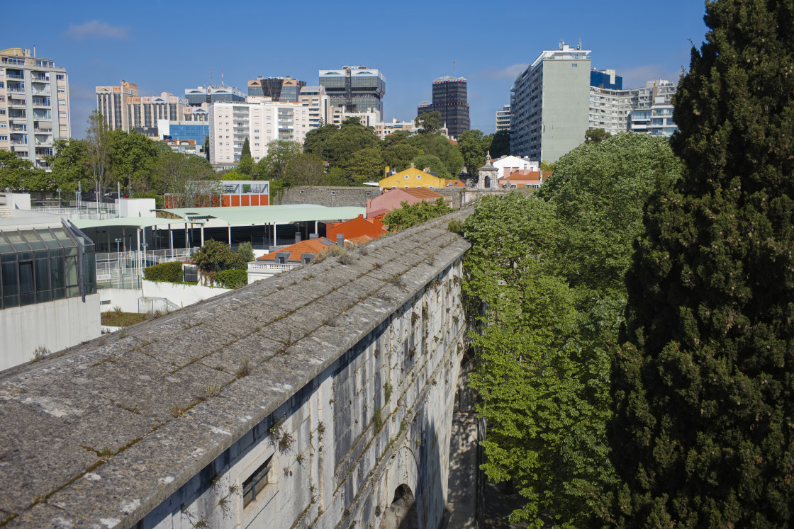 "Looking along the aqueduct at Amoreiris, Lisbon with high rise apartments behind" stock image