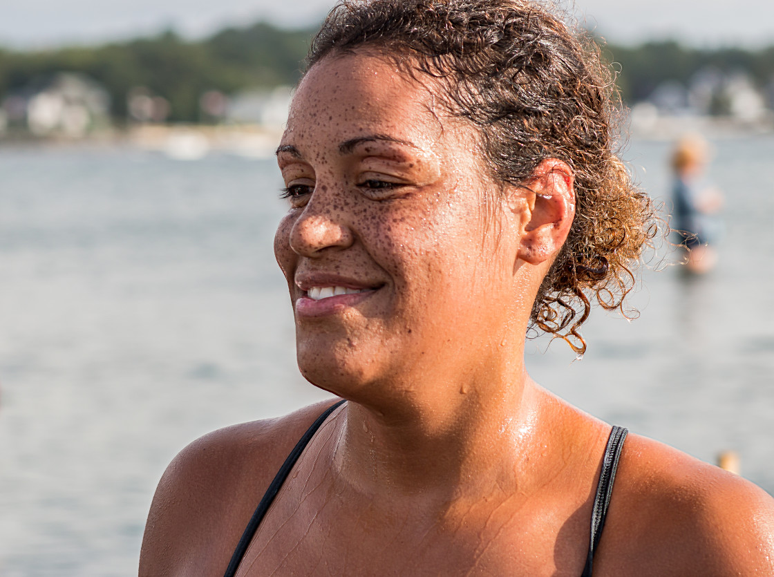 "Young black or mixed-race woman with freckles after a swim race" stock image