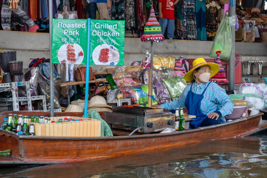 "Various goods, such as Thai food or drinks, are offered for sale on an original floating market Samut Sakhon Thailand Asia" stock image