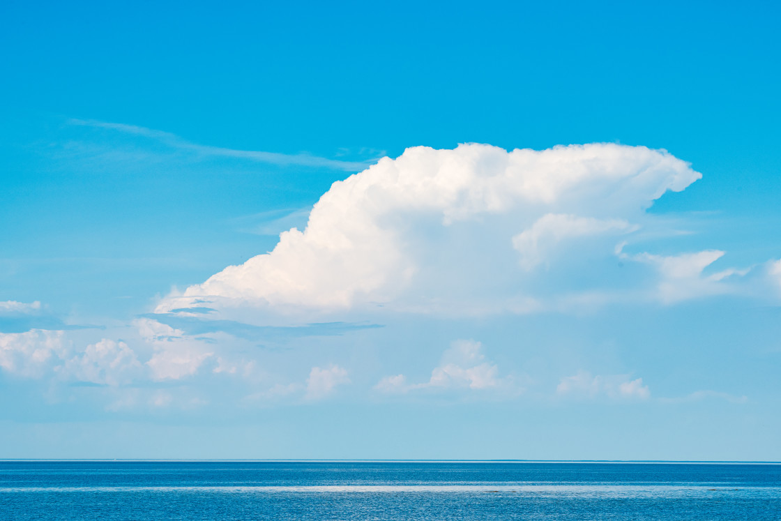 "Majestic White Cloud Hovering Over Serene Swedish Lake During Summer" stock image