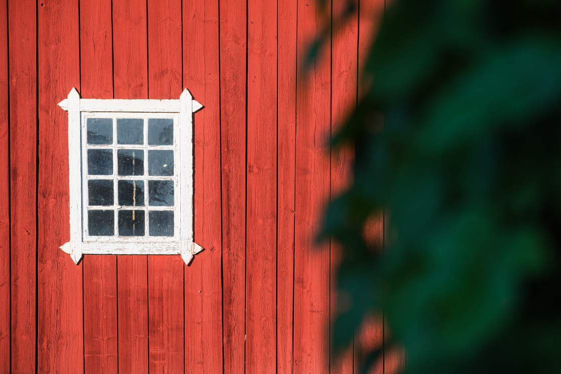 "Red Building With Window and Tree" stock image