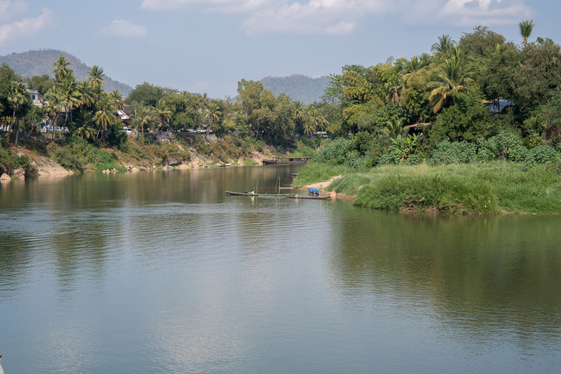 "The Nam Khan River, which flows into the Mekong River, is located in Luang Prabang, Laos, Asia." stock image