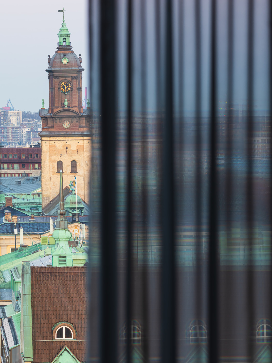 "View of a Historic Church Tower in Gothenburg, Sweden, Seen Through a Curtain" stock image