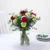 Media 1 - Mixed bouquet with red roses in warm and green tones