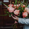 Media 5 - 12 Salmon Colored Roses with greenery