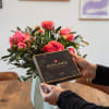 Media 2 - 12 peonies (coral) with greenery and Avelines pralines from Maestrani