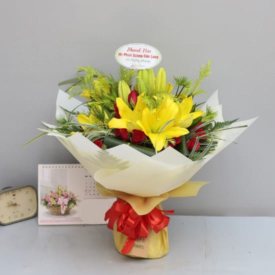 Yellow lilies with red and green