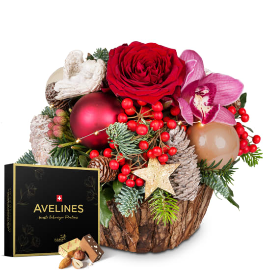 Arrangement floral «Histoire de Noël» avec guirlande lumineuse et pralinés Avelines de Maestrani