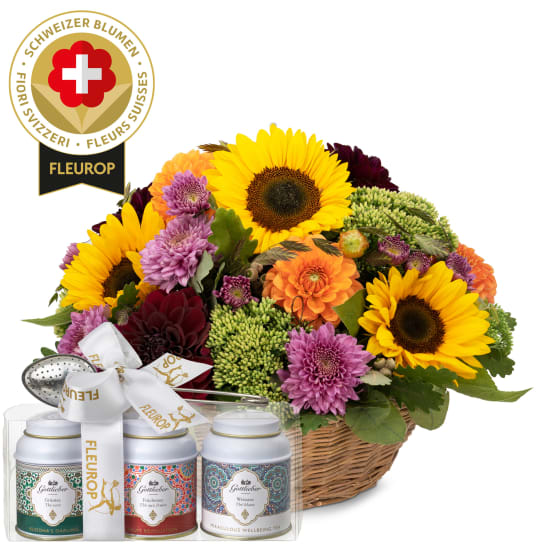 Arrangement d'automne avec des fleurs suisses et coffret cadeau de thés Gottlieber