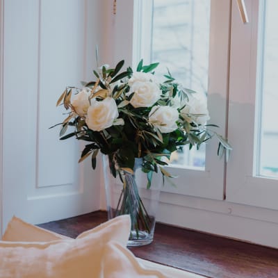 12 White Roses with greenery