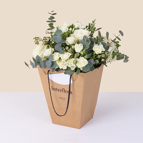 White and green bouquet with decorative bag