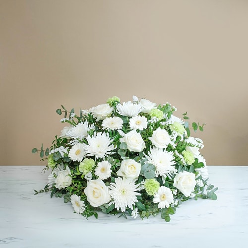 Funeral centrepiece in white tones