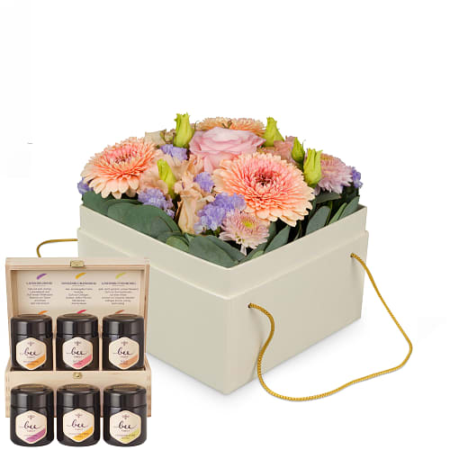 Scatola con fiori «Barcelona» (15 cm) e set regalo con diversi tipi di miele di Bee-Family