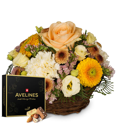 Composizione floreale «Bright Surprise» con praline Avelines di Maestrani