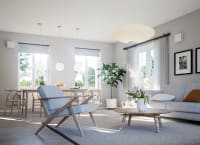 Single room ventilator Flexit Muto in white mounted on the living room wall