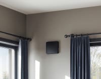 Living room with Flexit Aura One W black mounted on the wall