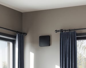 
                    Living room with Flexit Aura One W black mounted on the wall