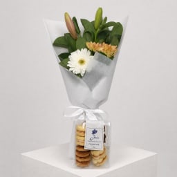 Daily Bouquet - Blush lilies, peach blooms, biscuit bonus