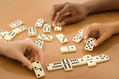 Family playing dominoes