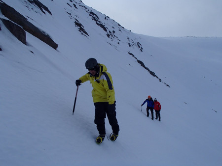 Using ice axe and crampons