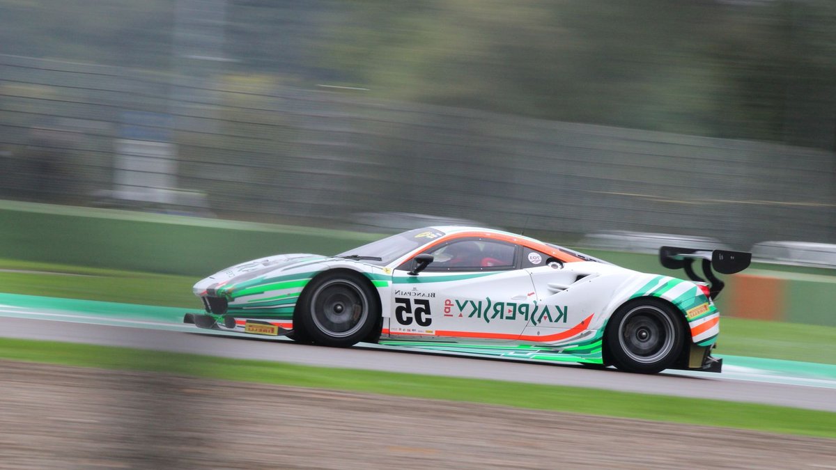 F1 Considers Imola as Middle East Races Hang in Balance Dynamic shot of a racing car speeding at Imola Circuit in Italy.