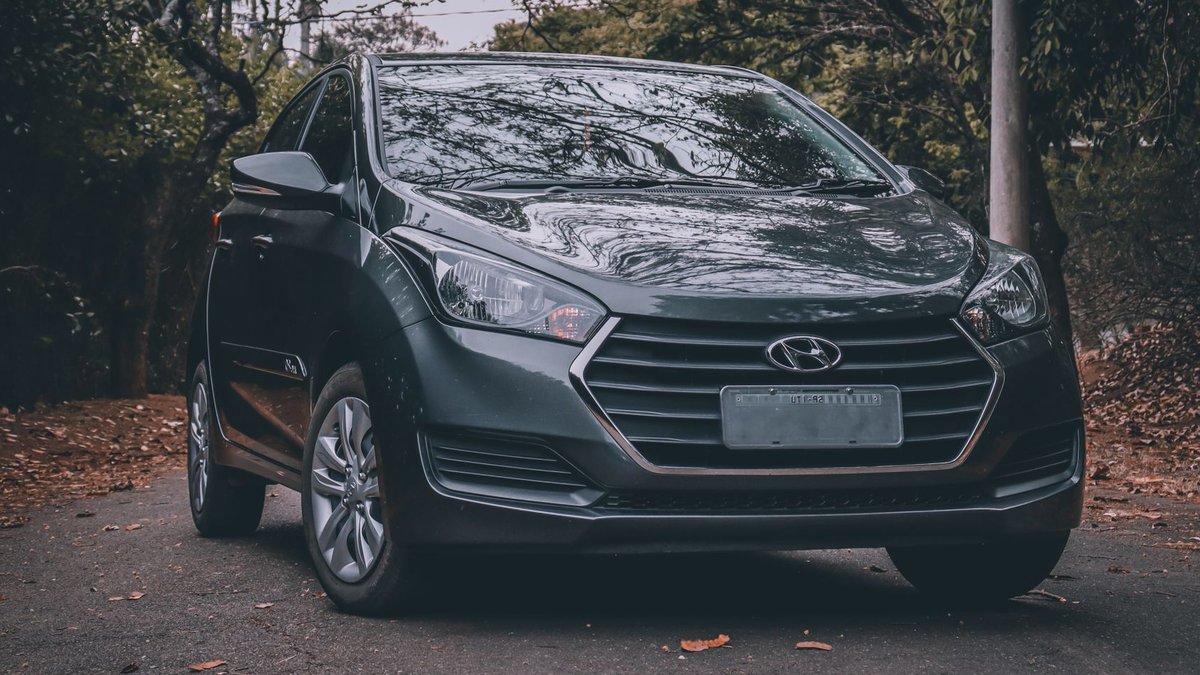 EEOC sues Hyundai over hiring practices Elegant black Hyundai car parked on a scenic road surrounded by trees, showcasing a modern automotive design.
