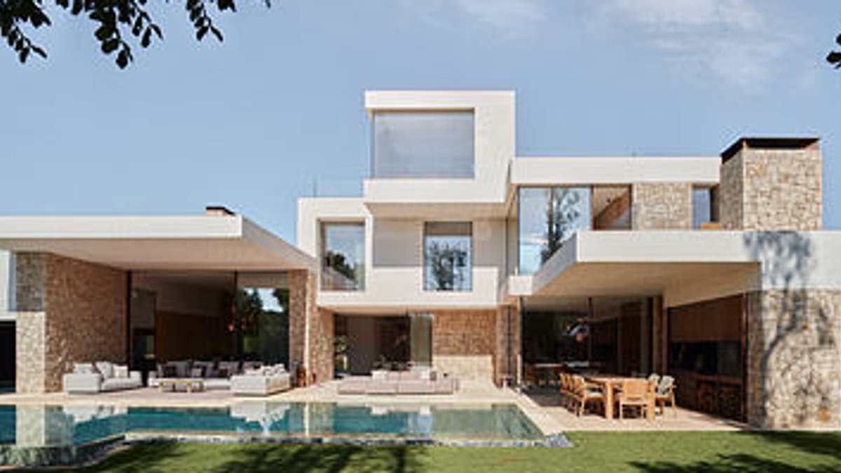 Olea House in Valencia Uses Stacked Stone Volumes - stacked stone house