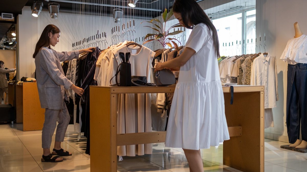 Trent's Q2 Growth Divides Analysts Amid Expansion, Cost Concerns Two women browsing clothes in a modern indoor fashion store.
