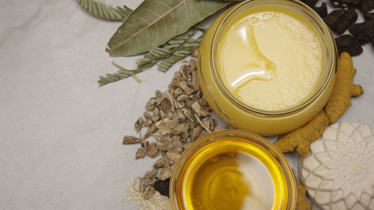 Flat lay of natural ingredients, herbs, and honey jars showcasing a healthy lifestyle and wellness theme.